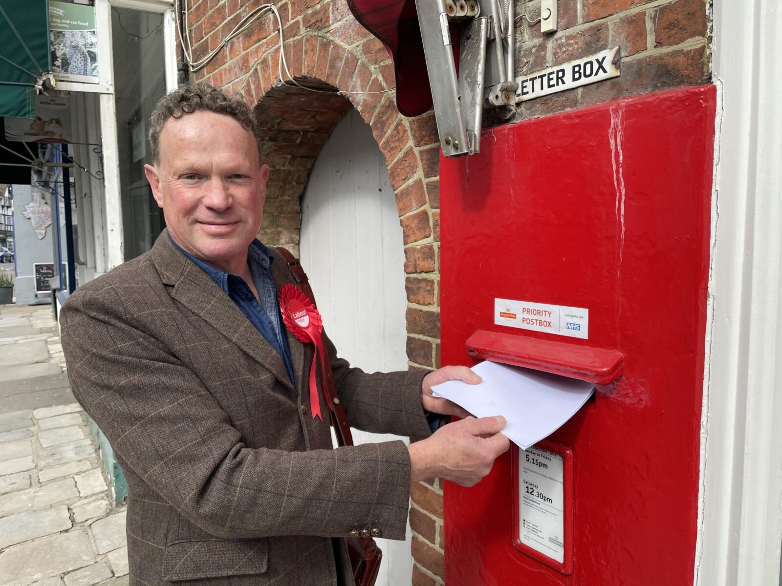 SImon Birnstingl at Steyning Post Office urging young people to vote in WSCC elections